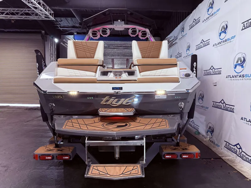 Slide: The Image of 2024 Tigé Ultré 23ZX boat displayed in showroom. - 6