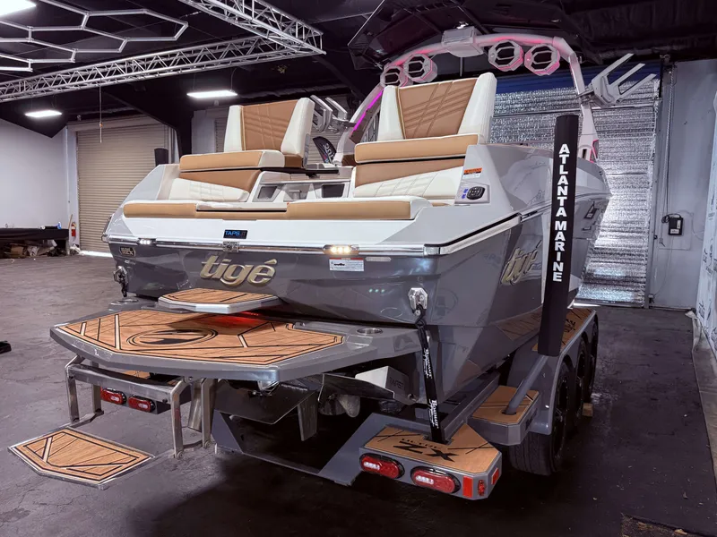 Slide: The Image of 2024 Tigé Ultré 23ZX boat indoors, luxurious design. - 7