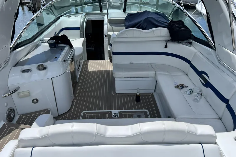 Slide: The Image of 2011 Formula 350 Sun Sport boat interior with white seating and kitchenette. - 1