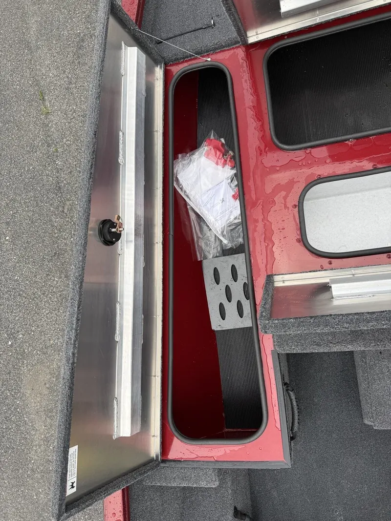 Slide: The Image of Interior view of 2026 Lowe Stinger ST175 boat storage compartment. - 5