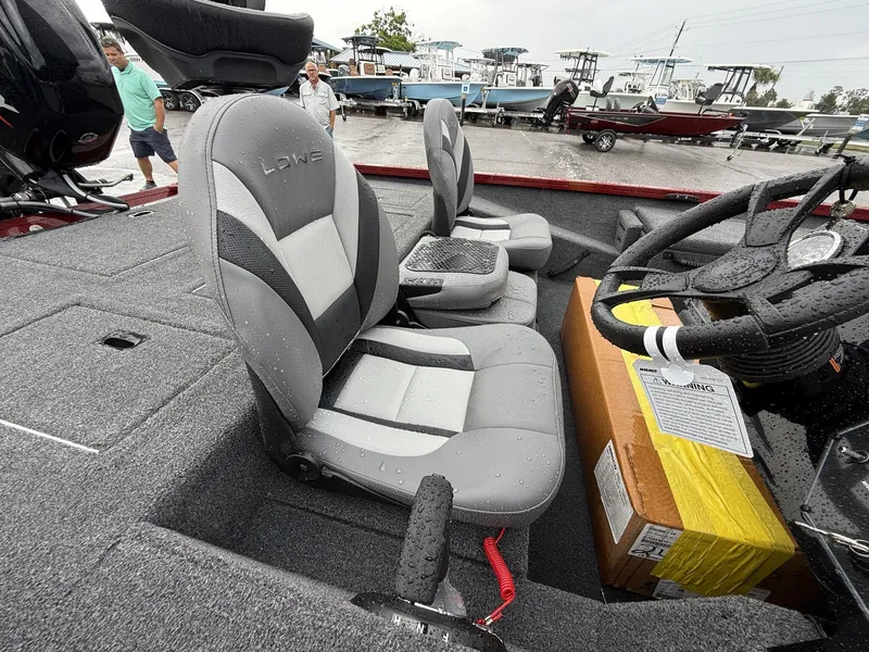 Slide: The Image of Interior of Lowe Stinger ST175 boat, 2026 model, featuring gray seats. - 8