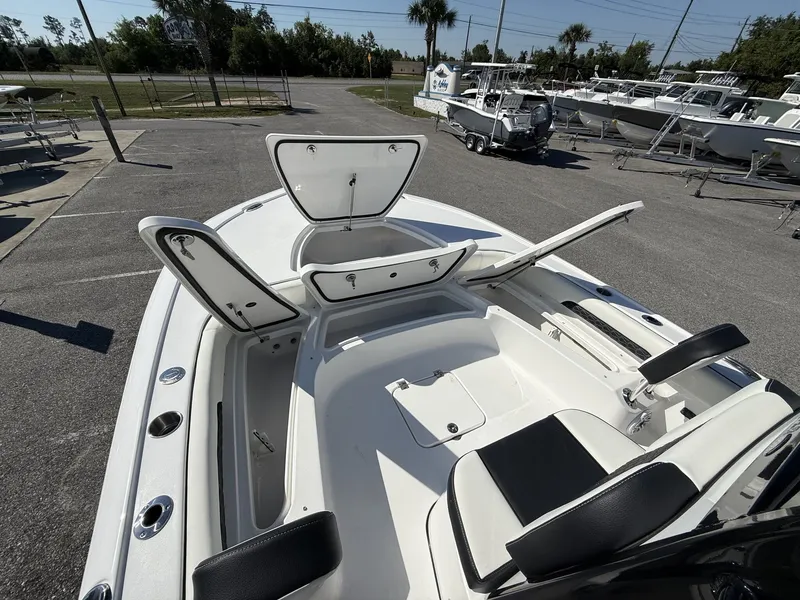 Slide: The Image of 2026 Tidewater 2500 Carolina Bay boat with open storage compartments. - 3