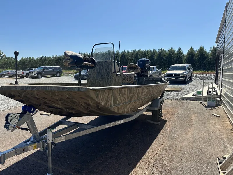 Slide: The Image of 2026 Lowe Roughneck Center Console JET 80 boat on trailer. - 3