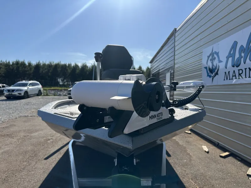 Slide: The Image of 2026 Xpress Hyper-Lift Bay Series H20 BAY-LOADED boat with Minn Kota motor. - 2