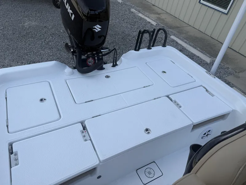 Slide: The Image of Blazer Purebay 2026 boat with Suzuki outboard motor and storage compartments. - 11