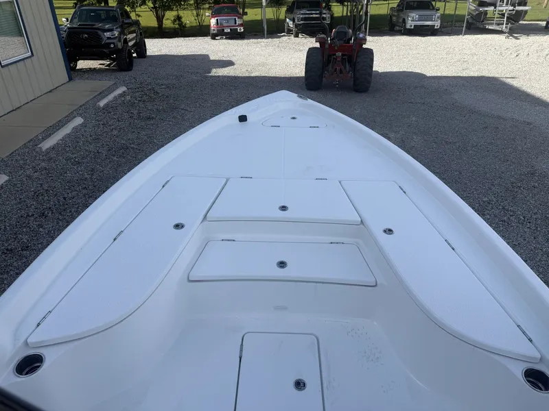 Slide: The Image of 2026 Blazer Purebay boat parked on gravel lot. - 5