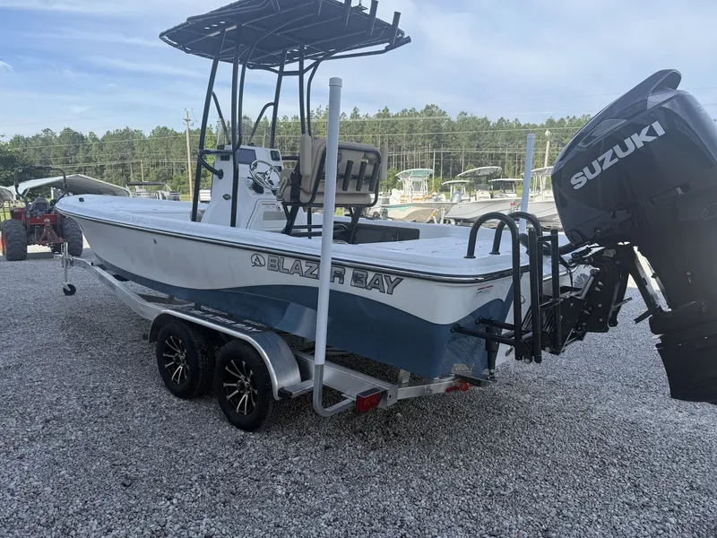 Slide: The Image of 2026 Blazer Purebay boat with Suzuki engine on trailer. - 7