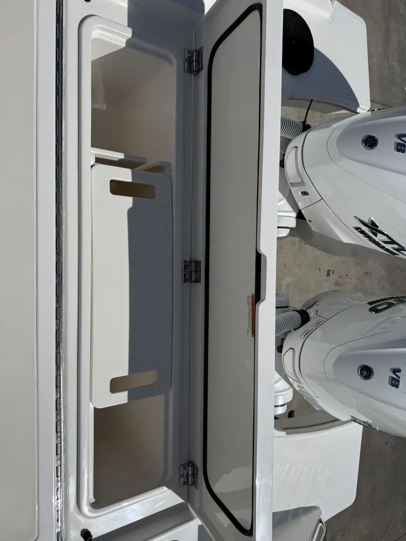 Slide: The Image of Open storage compartment on Pursuit S 358 Sport boat, 2026 model. - 14