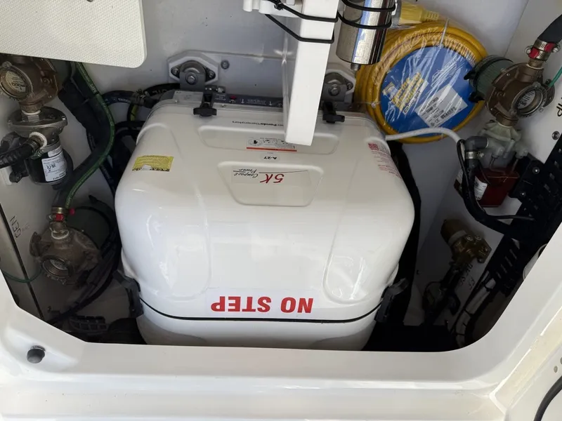 Slide: The Image of Engine compartment of 2026 Pursuit S 358 Sport with "No Step" label. - 15