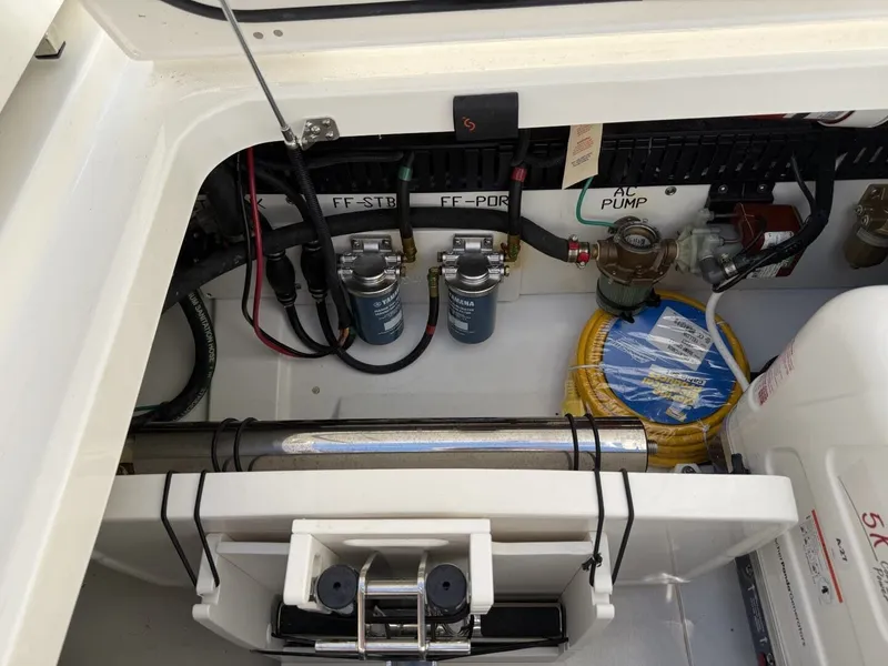 Slide: The Image of Interior view of Pursuit S 358 Sport 2026 boat engine compartment. - 16