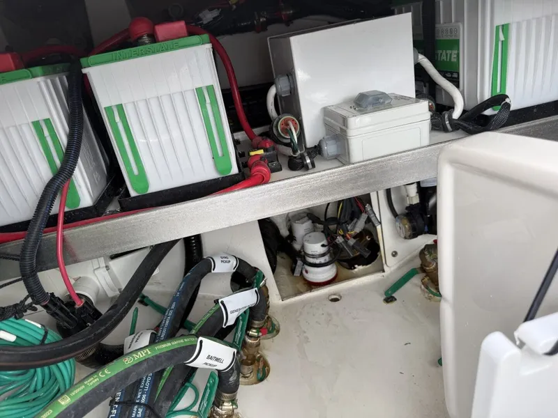 Slide: The Image of Battery compartment of 2026 Pursuit S 358 Sport with wiring. - 18