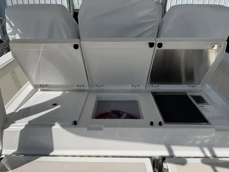 Slide: The Image of Interior view of 2026 Pursuit S 358 Sport with storage compartments. - 19