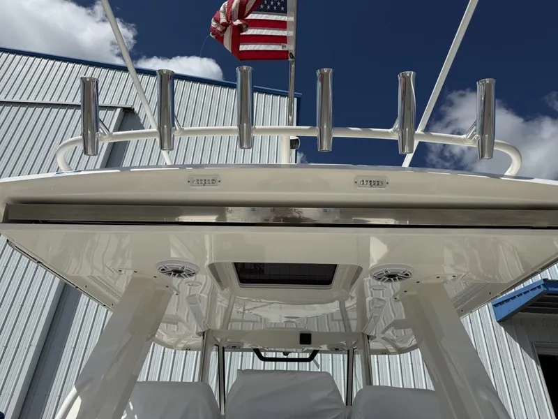 Slide: The Image of 2026 Pursuit S 358 Sport boat with rod holders and American flag. - 24