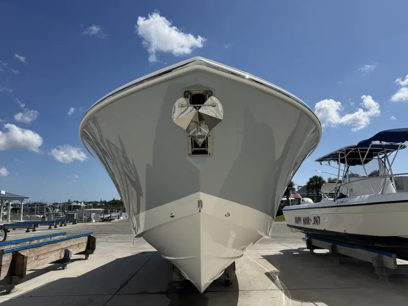 Slide: The Image of 2026 Pursuit S 358 Sport boat on a dock under sunny skies. - 3