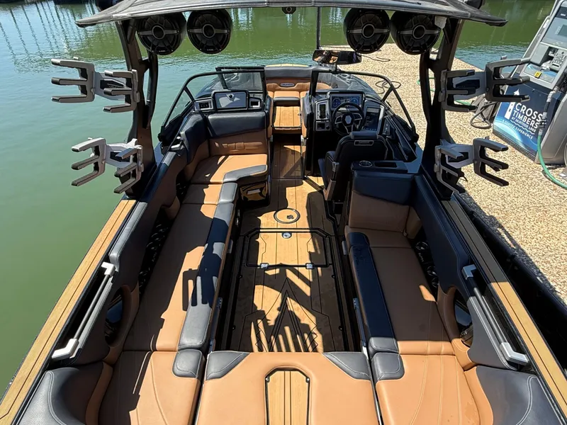 Slide: The Image of Interior view of a 2021 Supra SE 550 boat with luxurious seating. - 18