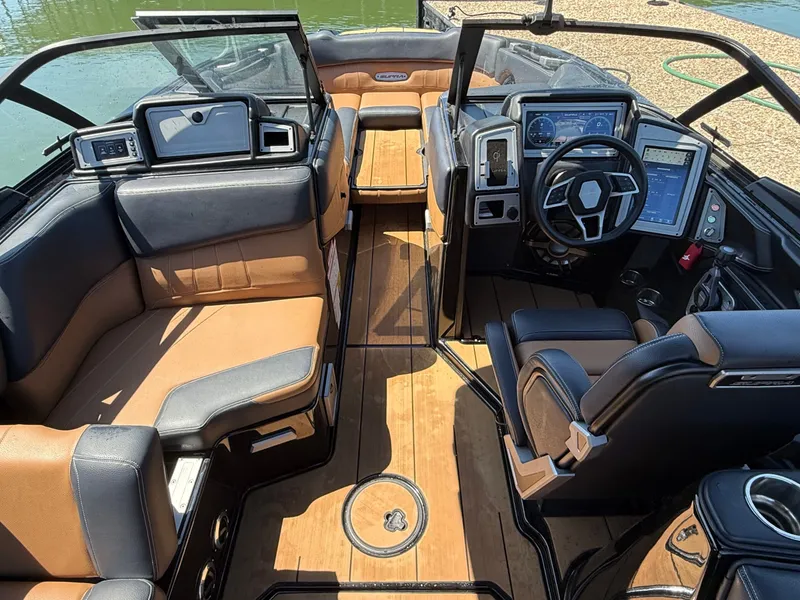 Slide: The Image of Interior of a 2021 Supra SE 550 boat with luxurious features. - 30