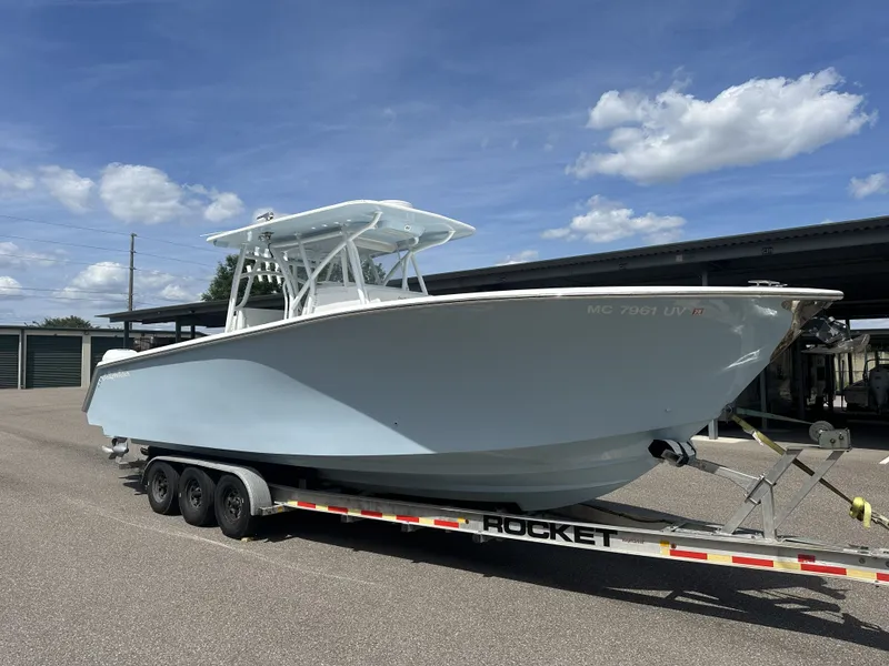 Slide: The Image of 2023 SeaHunter Tournament boat on trailer under blue sky. - 1
