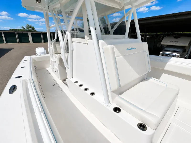 Slide: The Image of 2023 SeaHunter Tournament boat with white seating area. - 12