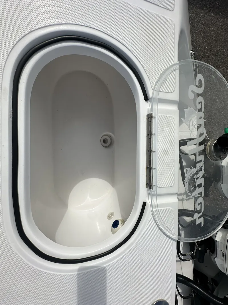 Slide: The Image of 2023 SeaHunter Tournament boat with open storage compartment lid. - 18