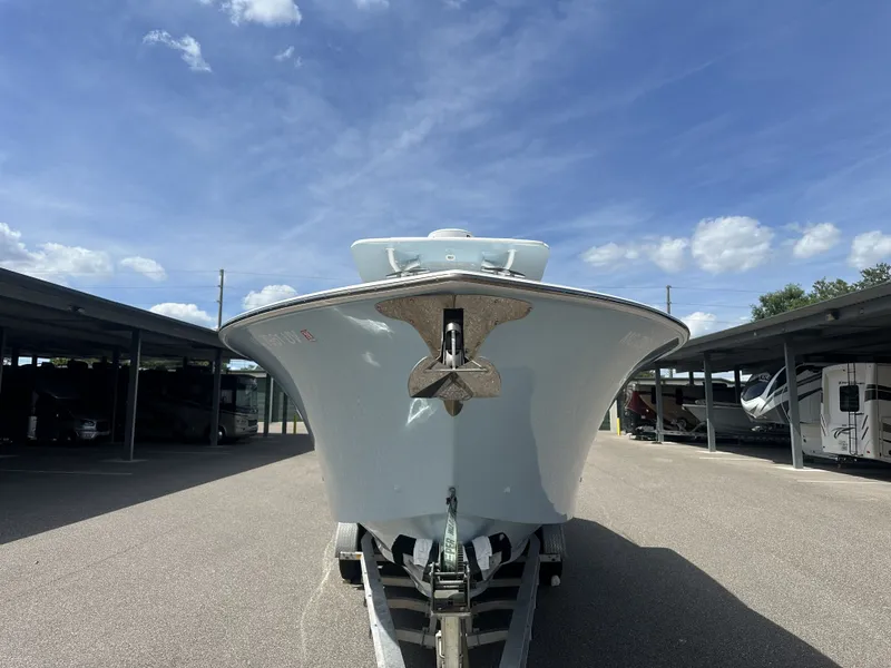 Slide: The Image of 2023 SeaHunter Tournament boat on trailer under blue sky. - 2