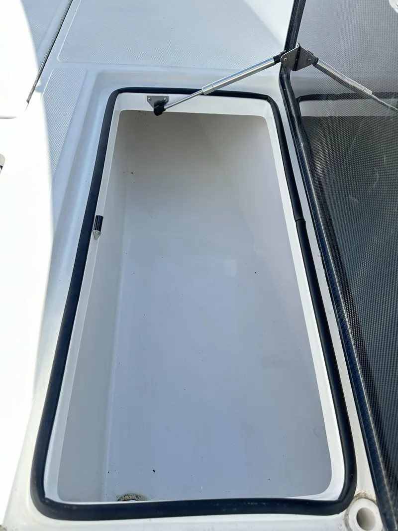 Slide: The Image of Open storage compartment on a 2023 SeaHunter Tournament boat. - 26