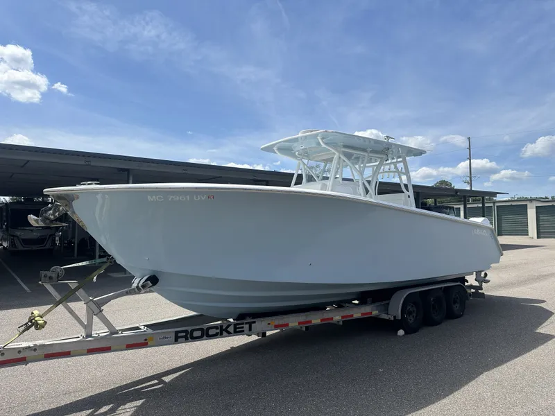 Slide: The Image of 2023 SeaHunter Tournament boat on trailer under sunny skies. - 3