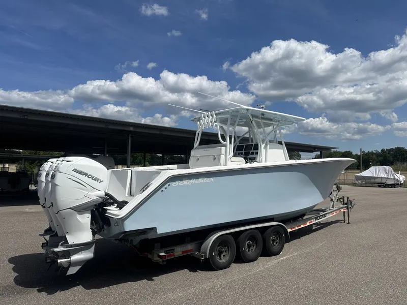 Slide: The Image of 2023 SeaHunter Tournament boat on trailer under blue sky. - 7