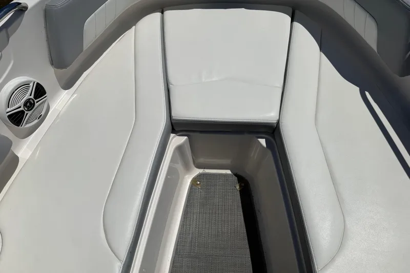 Slide: The Image of Interior seating of 2019 Chaparral 21 H2O Sport OB boat, featuring white upholstery. - 12