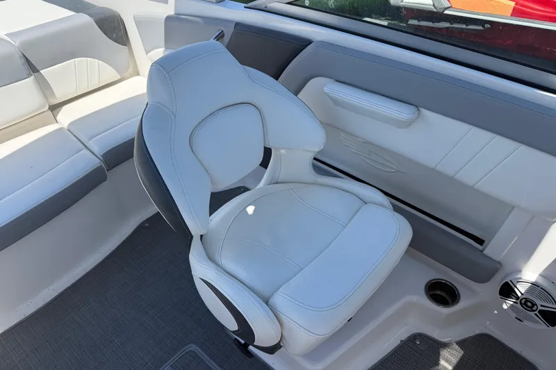 Slide: The Image of 2019 Chaparral 21 H2O Sport OB boat interior with white seating and modern design. - 13