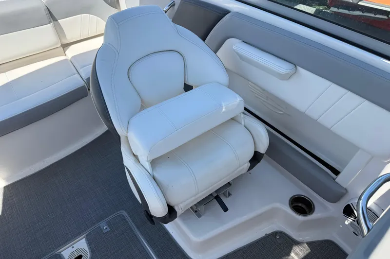 Slide: The Image of 2019 Chaparral 21 H2O Sport OB boat interior with white seating and gray accents. - 14