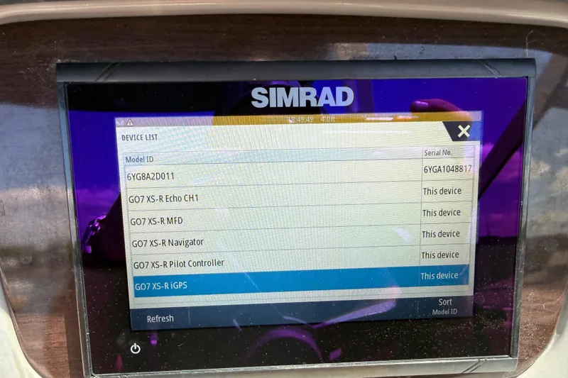 Slide: The Image of Simrad device list display on 2019 Chaparral 21 H2O Sport OB boat. - 23