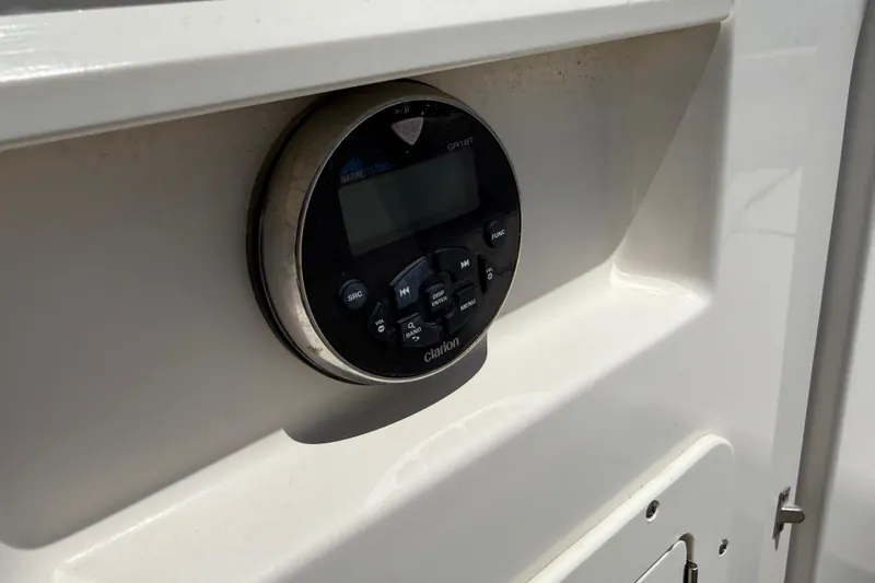Slide: The Image of Control panel on 2019 Chaparral 21 H2O Sport OB boat, featuring marine audio system. - 24