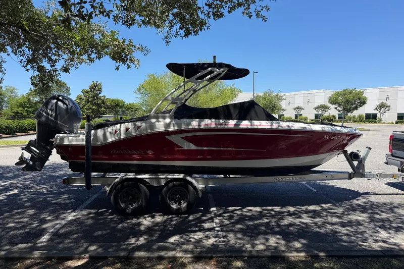 Slide: The Image of 2019 Chaparral 21 H2O Sport OB boat on trailer, parked outdoors. - 5
