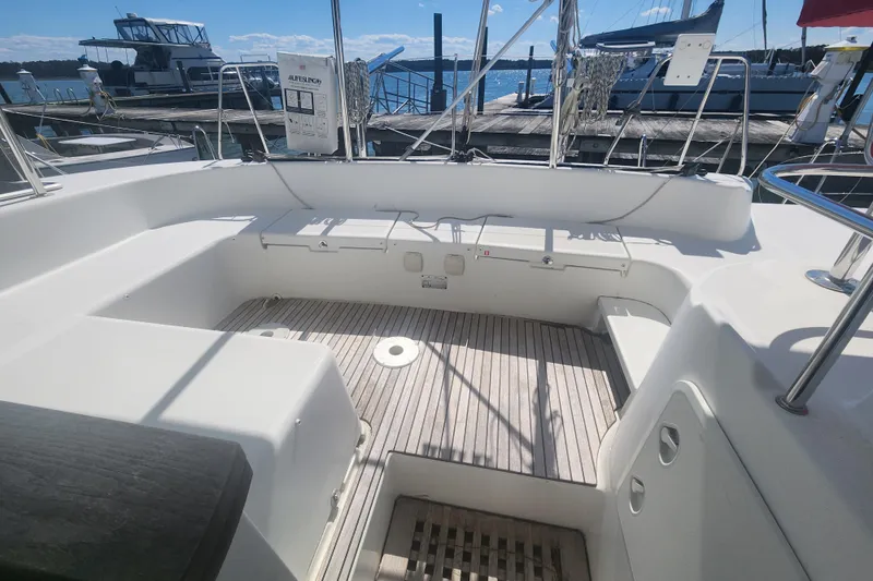 Slide: The Image of Spacious cockpit of a 2019 Lagoon 380 catamaran docked at a marina. - 29