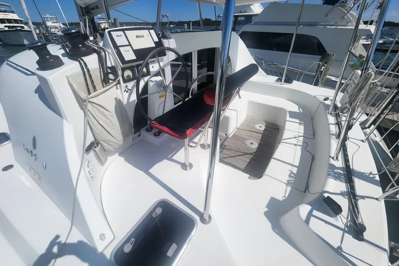Slide: The Image of Cockpit of 2019 Lagoon 380 catamaran with steering wheel and navigation equipment. - 40