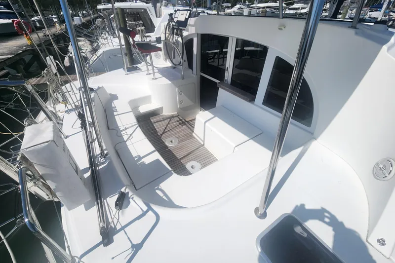 Slide: The Image of Spacious deck of 2019 Lagoon 380 catamaran with seating and helm station. - 41