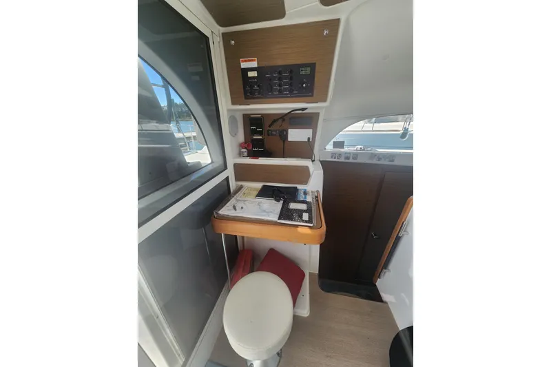 Slide: The Image of Interior view of a 2019 Lagoon 380 yacht's navigation station. - 5