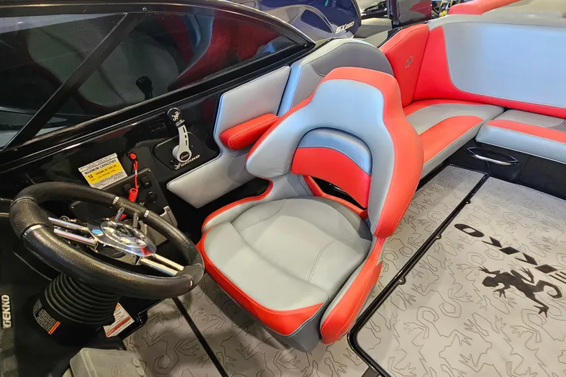 Slide: The Image of Interior of a 2017 Gekko Revo 7.1 boat with red and gray seating. - 13