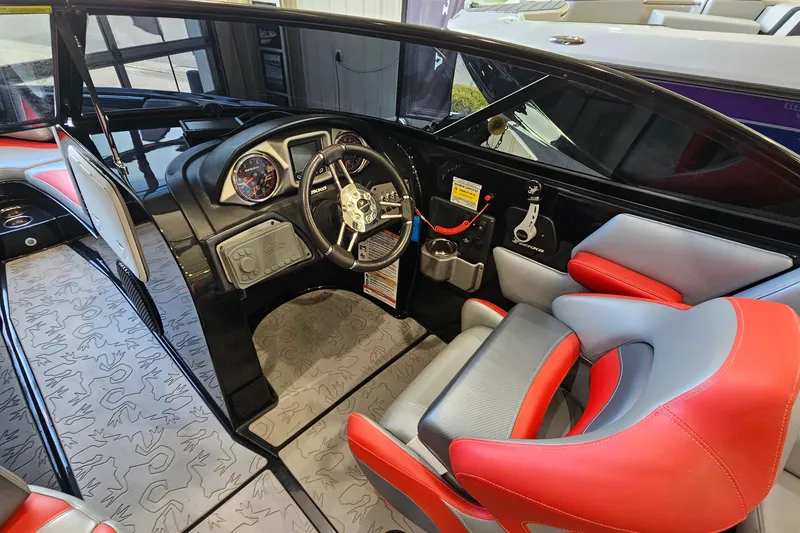Slide: The Image of Interior of a 2017 Gekko Revo 7.1 boat with red and gray seating. - 14