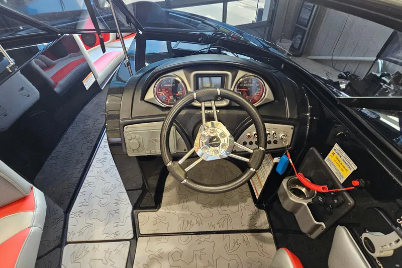 Slide: The Image of Cockpit of 2017 Gekko Revo 7.1 boat with steering wheel and dashboard controls. - 15