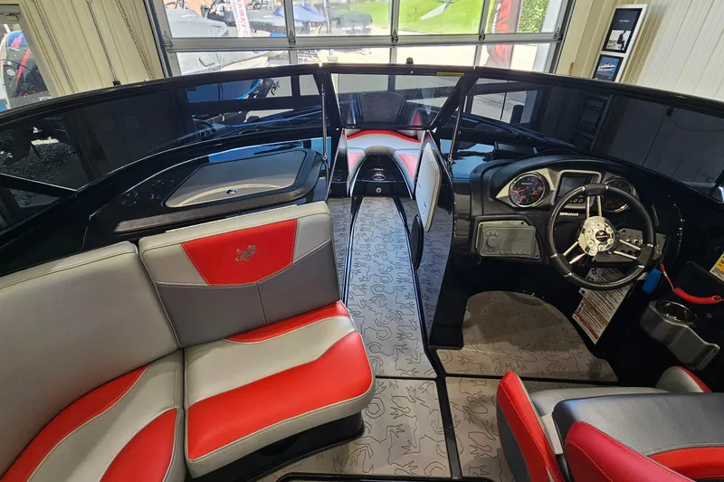 Slide: The Image of Interior of a 2017 Gekko Revo 7.1 boat with red and gray seating. - 16