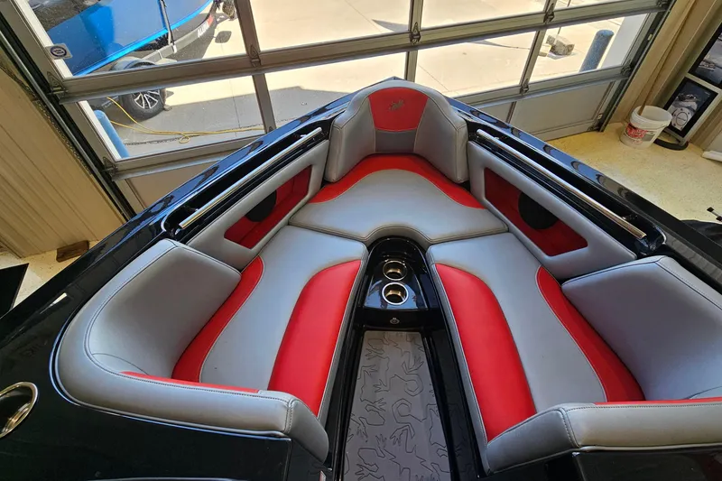 Slide: The Image of Interior of a 2017 Gekko Revo 7.1 boat with red and gray seating. - 17
