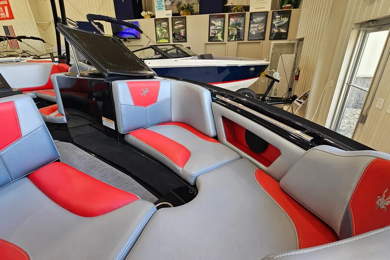 Slide: The Image of Interior of a 2017 Gekko Revo 7.1 boat with red and gray seating. - 20