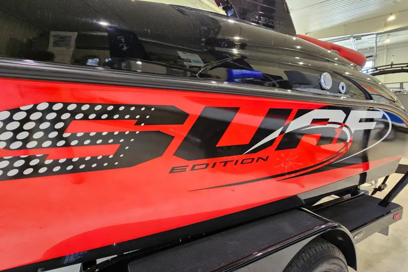 Slide: The Image of Red and black Gekko Revo 7.1 Surf Edition boat, 2017 model, in showroom. - 4