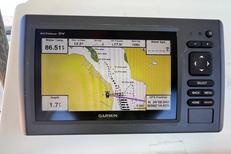 Slide: The Image of Garmin GPS display on 2016 NauticStar 2110 Sport showing navigation and water temperature. - 10