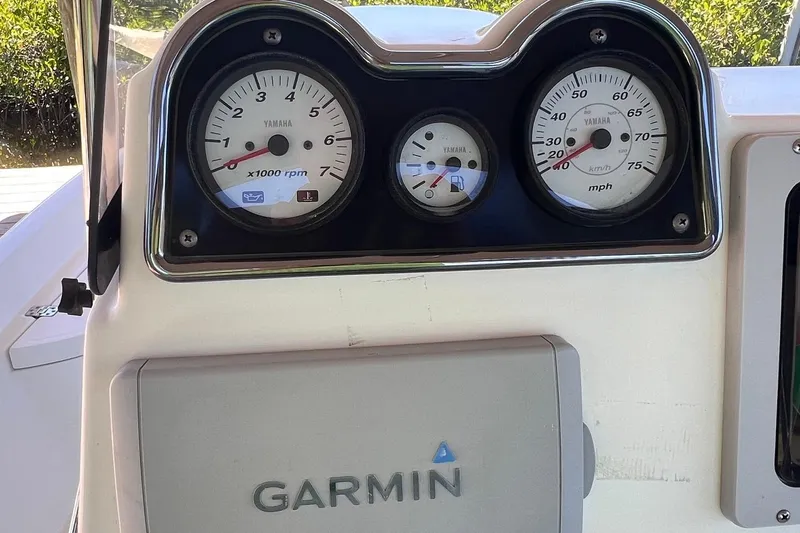 Slide: The Image of Dashboard of a 2016 NauticStar 2110 Sport boat with Yamaha gauges and Garmin device. - 12
