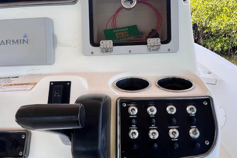 Slide: The Image of Control panel of a 2016 NauticStar 2110 Sport boat with Garmin device. - 13