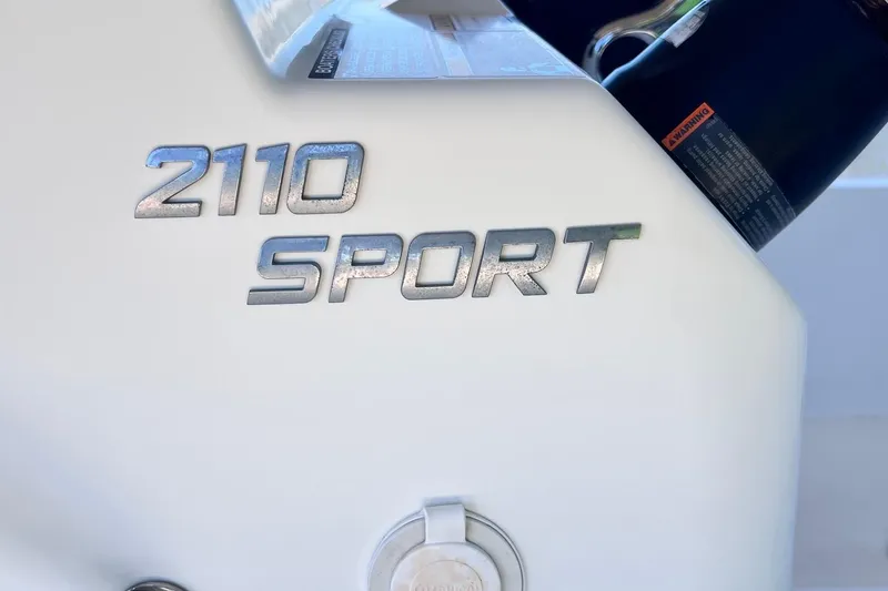 Slide: The Image of 2016 NauticStar 2110 Sport boat emblem on white surface. - 2