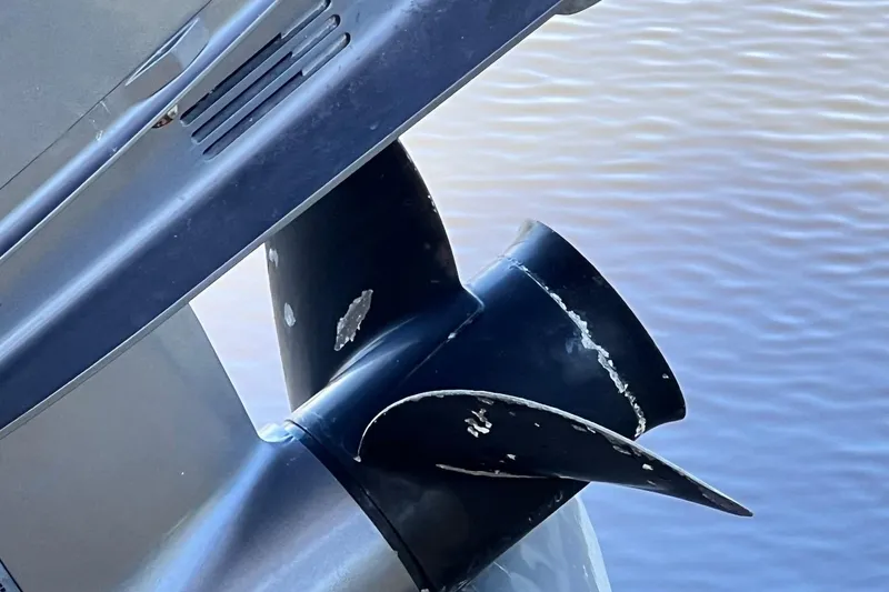 Slide: The Image of Propeller of a 2016 NauticStar 2110 Sport boat, showing wear and scratches. - 21