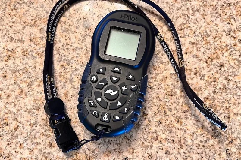 Slide: The Image of Remote control for Minn Kota i-Pilot on granite surface, 2016 NauticStar 2110 Sport. - 22